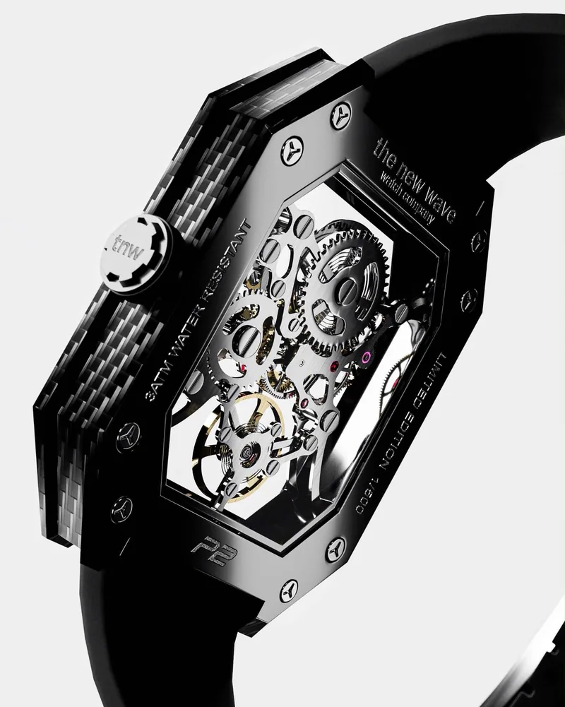 Project 2 case back at an angle: the chamfered carbon-fibre case, the TNW crown and the movement through the sapphire back